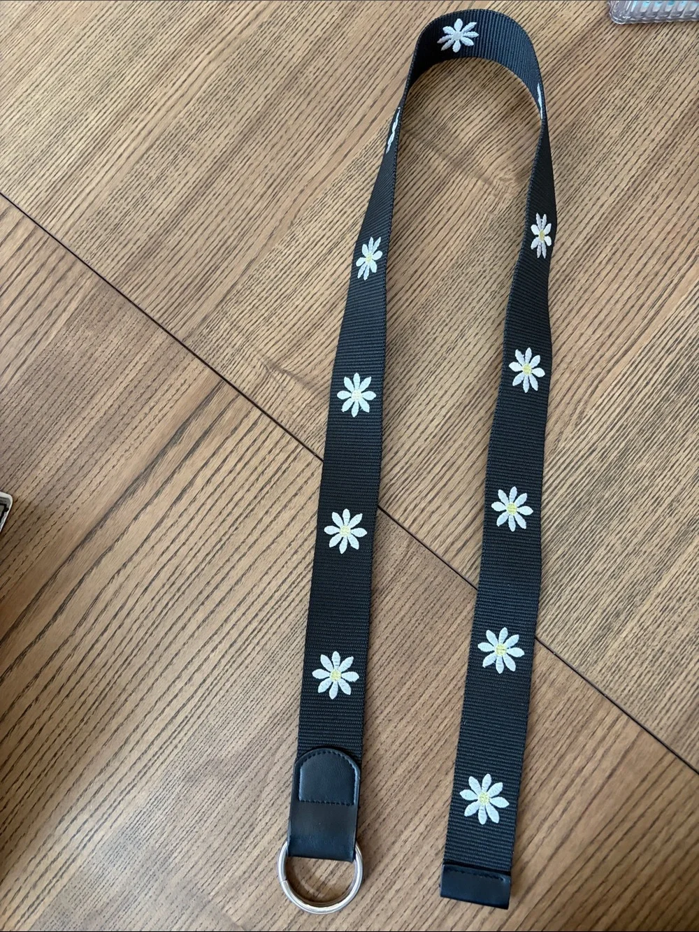 Black Webbed Belt with White Daisy Embroidered Design and Silver Ring Closure